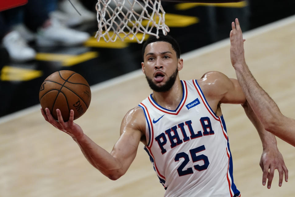 FILE - Philadelphia 76ers guard Ben Simmons (25) goes to the basket during their NBA playoff basketball game against the Atlanta Hawks, in Atlanta, in this Saturday, June 12, 2021, file photo. Ben Simmons can't shoot and lost his confidence. He blamed a mental block on the worst free-throw shooting percentage in NBA playoff history. The 76ers head into the offseason faced with a big question - do they try and salvage Simmons or deal the former No. 1 pick. (AP Photo/John Bazemore, File)