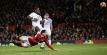 Manchester United's midfielder Henrikh Mkhitaryan (L) strikes the ball with the heel of his boot to score against Sunderland at Old Trafford in Manchester, in December 2016