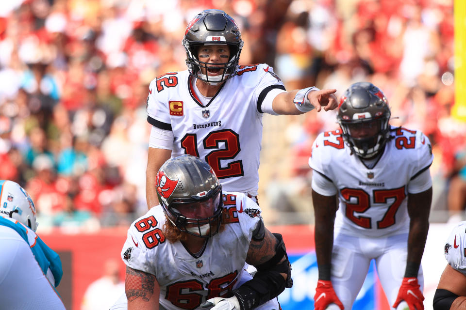 TAMPA, FLORIDA - OCTOBER 10: Tom Brady #12 of the Tampa Bay Buccaneers directs the offense against the Miami Dolphins during the fourth quarter at Raymond James Stadium on October 10, 2021 in Tampa, Florida. (Photo by Mike Ehrmann/Getty Images)