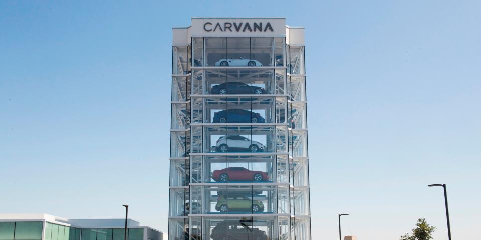 A Carvana vehicle showroom is shown
