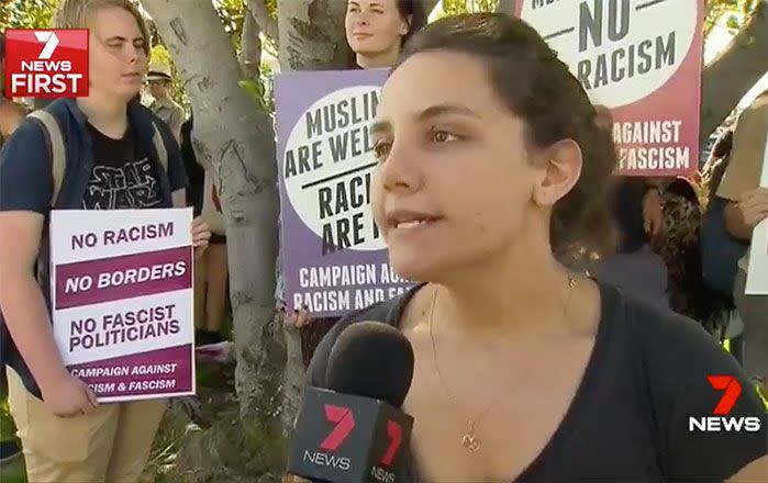 Anneke Demanuele was one of dozens of protestors demonstrating against the Q Society event. Photo: 7 News