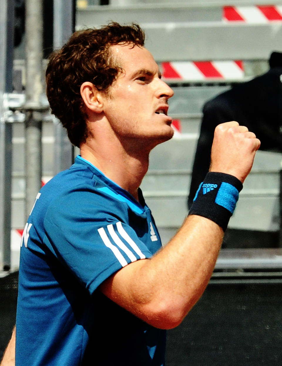 Britain's Andy Murray clinches his fist after winning a point to Italy's Fabio Fognini during a Davis Cup World Group quarterfinal match in Naples, Italy, Sunday, April 6, 2014. (AP Photo/Salvatore Laporta)