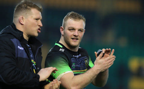 Hartley chats to hooker Haywood as they leave the field - Credit: AFP