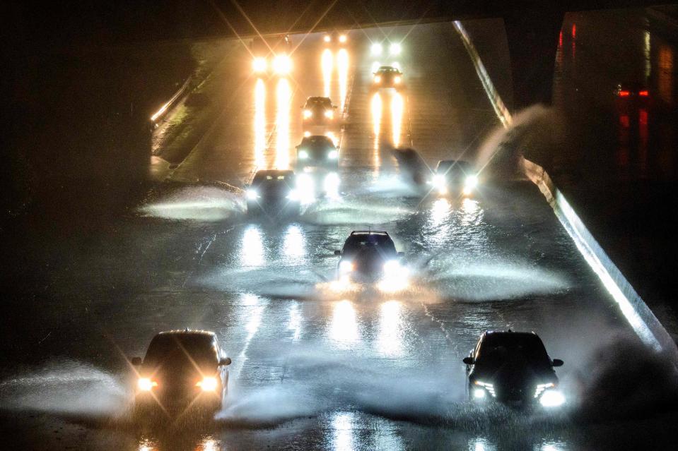 Drivers barrel into standing water on Interstate 101 in San Francisco, California on January 4, 2023.