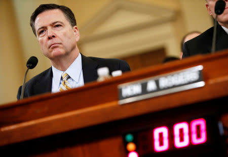 FILE PHOTO: FBI Director James Comey testifies before the House Intelligence Committee hearing into alleged Russian meddling in the 2016 U.S. election, on Capitol Hill in Washington, U.S., March 20, 2017. REUTERS/Joshua Roberts/File Photo