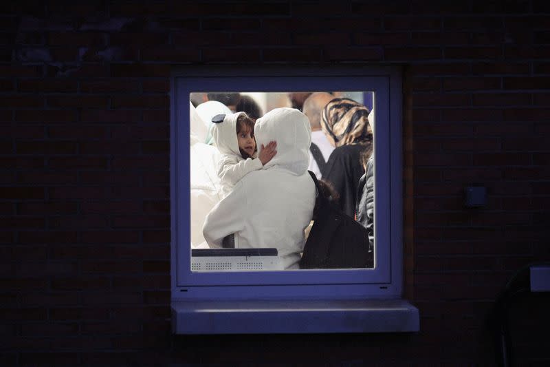 Spanish-Palestinians and Palestinians evacuated from Gaza arrive at a military base outside Madrid