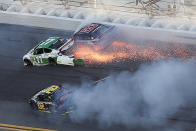 Jacob Heafner (77), Dave Mader III (63) and Andy Seuss (02) wreck in Turn 1 during the ARCA series auto race at Daytona International Speedway, Saturday, Feb. 8, 2020, in Daytona Beach, Fla. (AP Photo/David Graham)