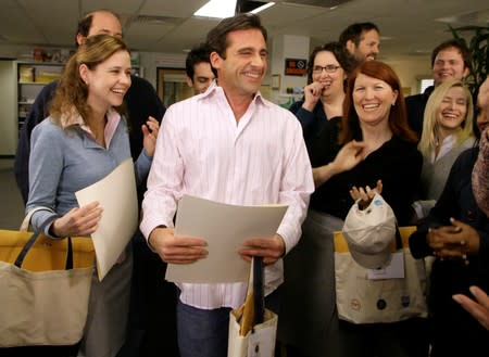 FILE PHOTO: Actor Steve Carell laughs along with other members of "The Office" cast in Panorama City