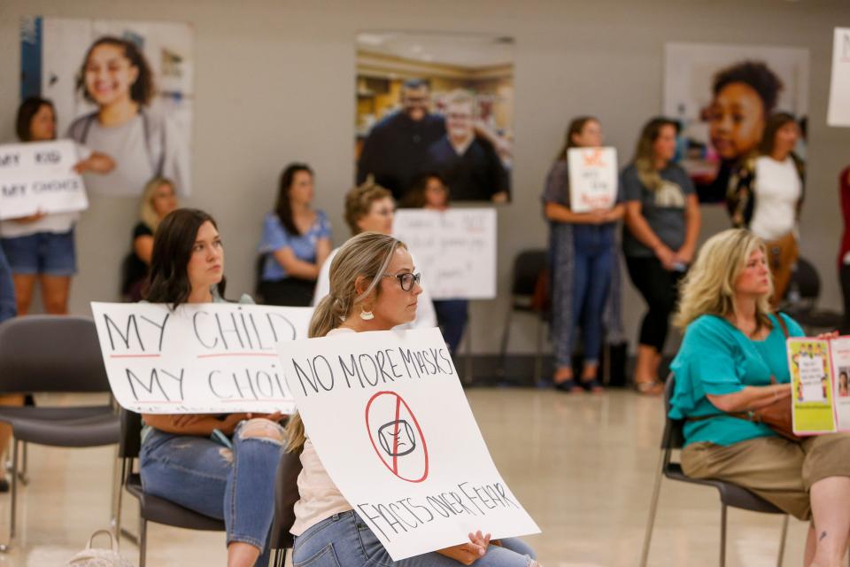 Parents protest mask requirements at a school board meeting at the Clarksville-Montgomery County School System's main offices in Clarksville, Tenn., in July 2021.