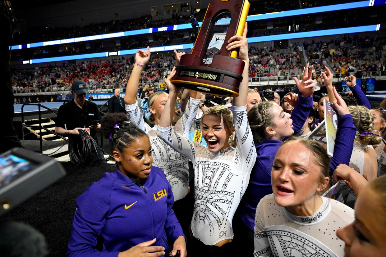 The LSU gymnastics team celebrates after winning the national championship.