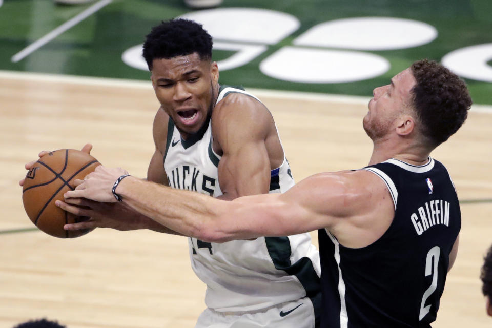 Milwaukee Bucks' Giannis Antetokounmpo drives to the basket against Brooklyn Nets' Blake Griffin during the first half of an NBA basketball game Tuesday, May 4, 2021, in Milwaukee. (AP Photo/Aaron Gash)