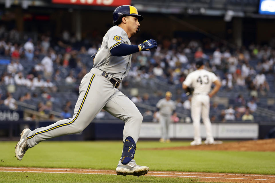 Milwaukee Brewers' Tyrone Taylor rounds first base after hitting a home run off of New York Yankees pitcher Jonathan Loaisiga (43) during the eighth inning of a baseball game Saturday, Sept. 9, 2023, in New York. (AP Photo/Adam Hunger)