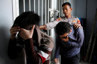 <p>Two Indonesian men, who were later sentenced to 85 lashes of the cane for having sex together, are escorted by police into an Islamic court in Banda Aceh, Aceh province, Indonesia May 17, 2017. (Photo: Junaidi Hanafiah/Reuters) </p>