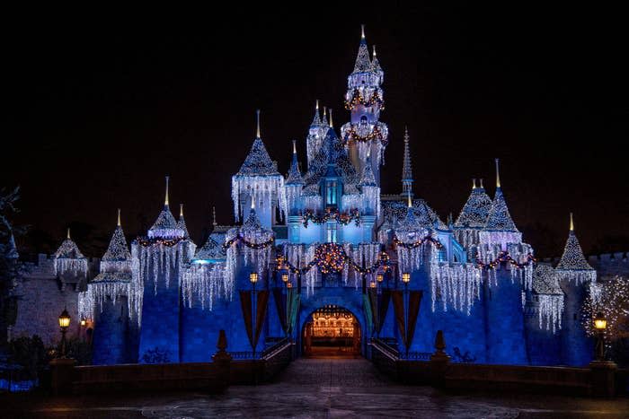 Sleeping Beauty's castle covered in icicles and lights