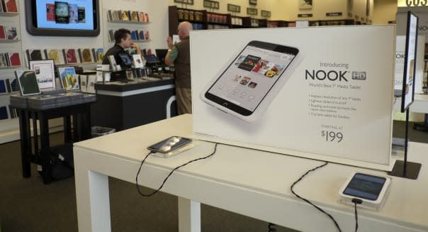 FILE - In this Tuesday, Feb. 26, 2013 file photo, nook tablets are on display at a Barnes and Noble bookstore in Los Angeles. Barnes & Noble is teaming up with Google to vastly increase the number of apps available on its Nook HD tablets. The bookstore chain says it will add Google?s Play app store to its Nook HD and HD+ products via a software update on Friday, May 3, 2013. (AP Photo/Jae C. Hong, File)