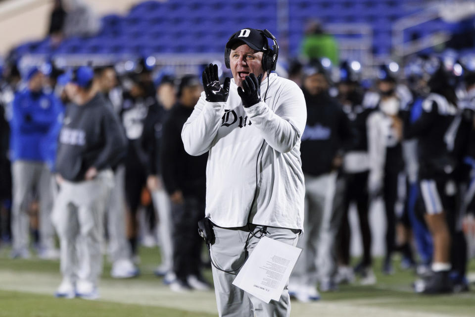 Duke head coach Mike Elko claps for his team during the first half of an NCAA college football game against Wake Forest in Durham, N.C., Thursday, Nov. 2, 2023. (AP Photo/Ben McKeown)