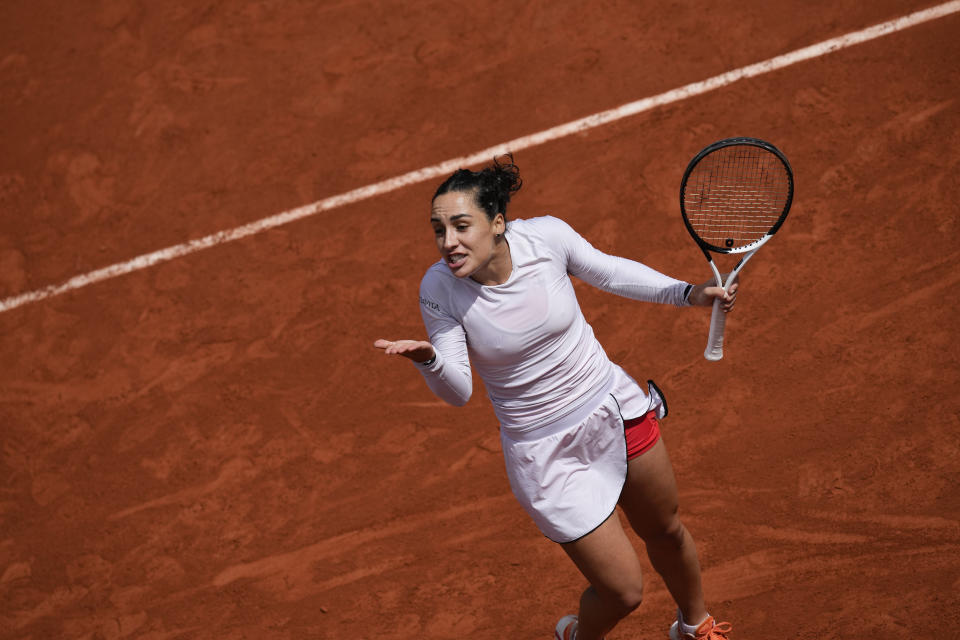 Italy's Martina Trevisan reacts after missing a shot against Aliaksandra Sasnovich of Belarus during their fourth round match at the French Open tennis tournament in Roland Garros stadium in Paris, France, Sunday, May 29, 2022. (AP Photo/Christophe Ena)