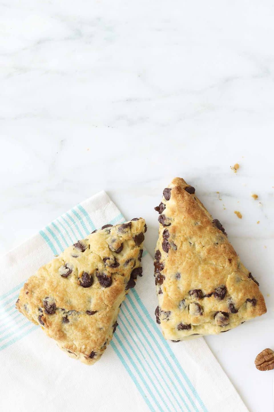 breakfast in bed two chocolate chip scones on blue and white cloth