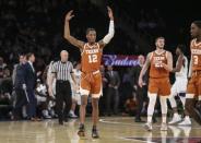 Apr 2, 2019; New York, NY, USA; Texas Longhorns guard Kerwin Roach II (12) celebrates against the Texas Christian Horned Frogs in the first half of the NIT semifinals at Madison Square Garden. Mandatory Credit: Wendell Cruz-USA TODAY Sports