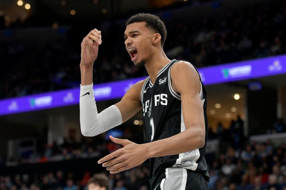 San Antonio Spurs center Victor Wembanyama (1) reacts in the first half of an NBA basketball game against the Memphis Grizzlies Tuesday, Jan. 2, 2024, in Memphis, Tenn. (AP Photo/Brandon Dill)