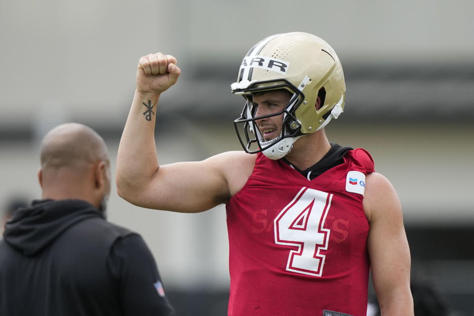 New Orleans Saints quarterback Derek Carr (4) gestures between drills during an NFL football practice in Metairie, La., Tuesday, June 6, 2023. (AP Photo/Gerald Herbert)