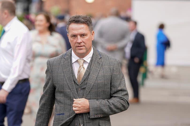 Michael Owen arrives at the track during Ladies Day at Aintree Racecourse