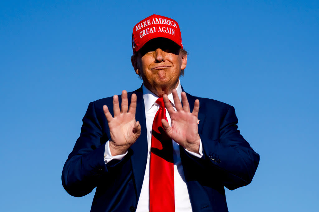Republican presidential candidate, former U.S. President Donald Trump holds his hands up during a rally on May 1, 2024 at Avflight Saginaw in Freeland, Michigan. Saginaw County is considered a swing county in Michigan and was the site of a September 2020 campaign visit by Trump. (Photo by Nic Antaya/Getty Images)