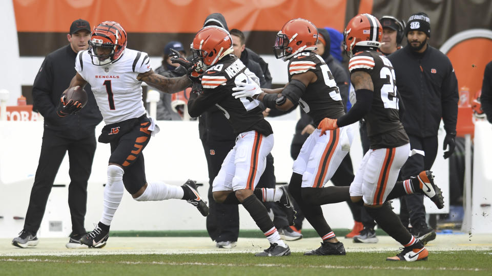 Cincinnati Bengals wide receiver Ja'Marr Chase (1) rushes against the Cleveland Browns during the first half of an NFL football game, Sunday, Jan. 9, 2022, in Cleveland. (AP Photo/Nick Cammett)