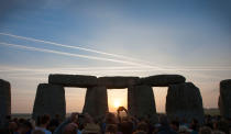 <p>Revellers celebrate summer solstice and the dawn of the longest day of the year at Stonehenge on June 21, 2017 in Wiltshire, England. (Photo: Kiran Ridley/Barcroft Images/Barcroft Media via Getty Images) </p>