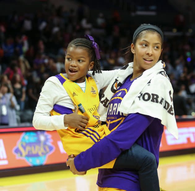 Candace Parker holds her daughter, Lailaa Nicole Williams, after an WBNA basketball game in Los Angeles on Sept. 30, 2016. (Photo: via Associated Press)