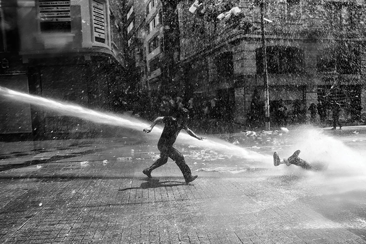 Police use water canon to disperse the crowd near Taksim Square in Istanbul. The civil unrest began in May 2013 after the violent eviction of a sit-in at Gezi park protesting an urban development plan (Emin Ozmen/Magnum Photos)