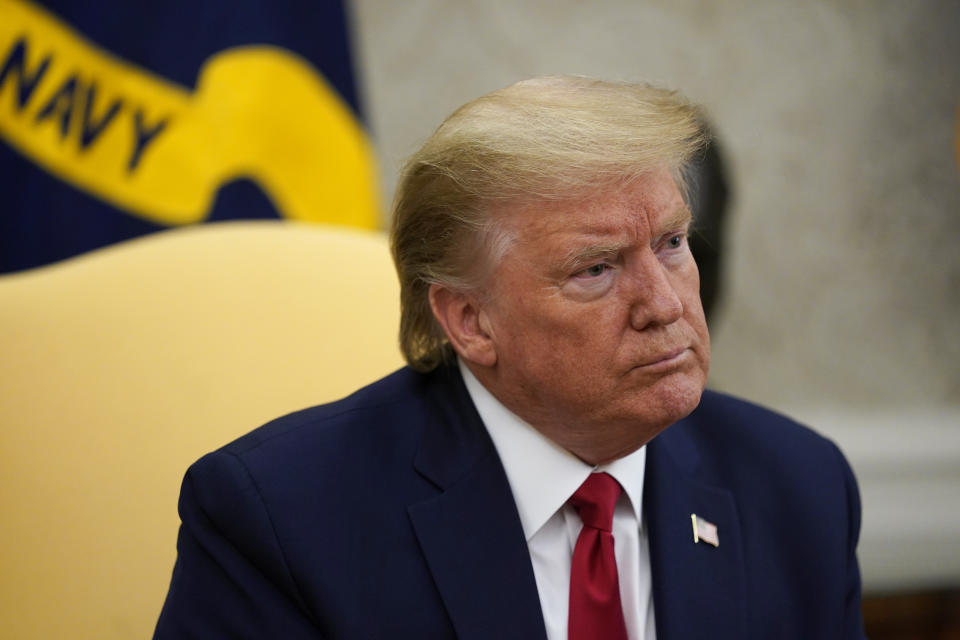 FILE - In this May 7, 2020, file photo President Donald Trump listens during a meeting about the coronavirus response in the Oval Office of the White House in Washington. Trump is hoping to persuade a Supreme Court with two of his appointees to keep his tax and other financial records from being turned over to lawmakers and a New York district attorney. The justices are hearing arguments by telephone Tuesday, May 12. (AP Photo/Evan Vucci, File)