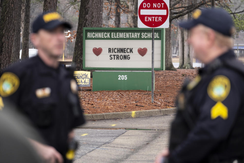 FILE - Police look on as students return to Richneck Elementary in Newport News, Va., on Jan. 30, 2023. The Virginia teacher who was shot and wounded by her 6-year-old student at the school said Monday, March 20, that she has had four surgeries and has gone through a challenging recovery. (Billy Schuerman/The Virginian-Pilot via AP, File)