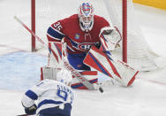 Montreal Canadiens goaltender Sam Montembeault stops Tampa Bay Lightning's Steven Stamkos during the third period of an NHL hockey game Tuesday, March 21, 2023, in Montreal. (Graham Hughes/The Canadian Press via AP)