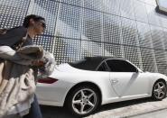 A woman walks past a Porsche on the Garosugil or the Tree-Lined Street in the Gangnam area of Seoul. Gangnam is the most upmarket neighbourhood in the South Korean capital. Known as Seoul's "Beverly Hills", its streets are lined with designer-brand shops and trendy bars and restaurants. Chubby South Korean singer Psy was raised in the area and his hit song "Gangnam Style", with his quirky horse-riding dance, has stormed to number one in charts around the world while the video has been watched more than 454 million times on YouTube since July.