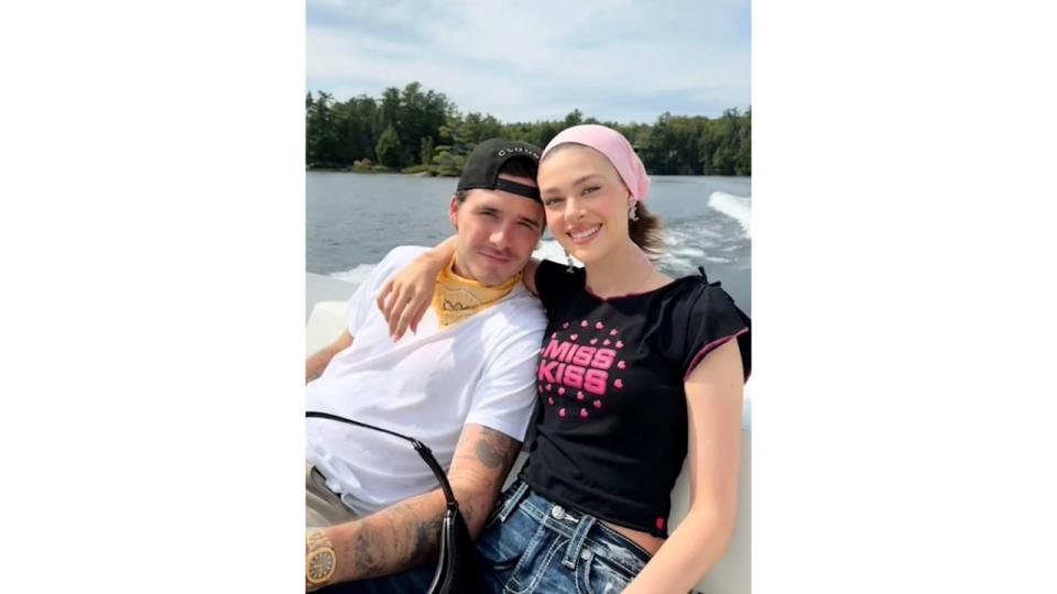 Nicola Peltz Beckham poses with her husband Brooklyn on a boat