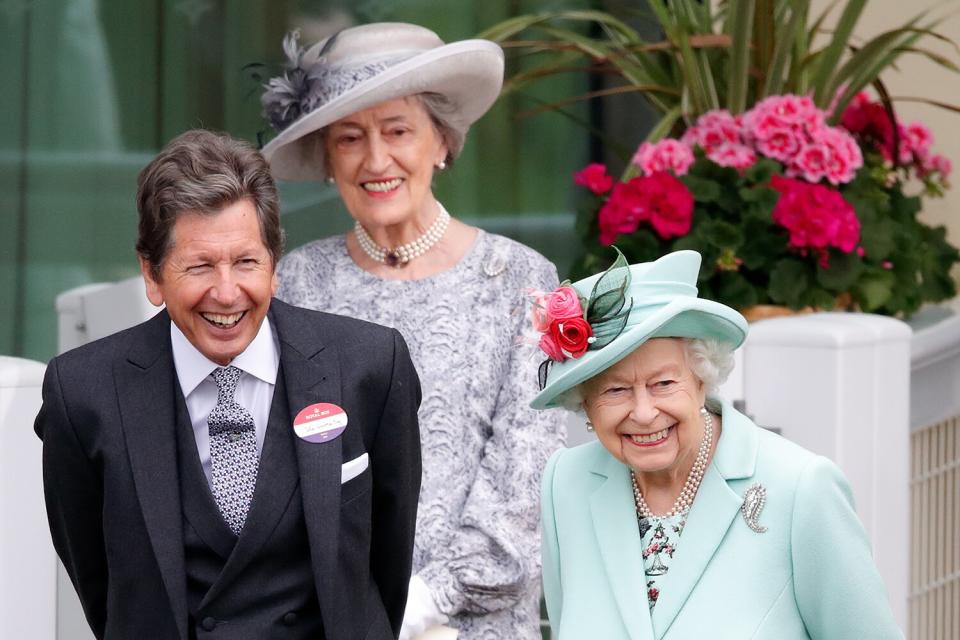 Queen Elizabeth II, accompanied by her racing manager John Warren and her lady-in-waiting Lady Susan Hussey , stands in the parade ring on day 5 of Royal Ascot at Ascot Racecourse on June 19, 2021 in Ascot, England.