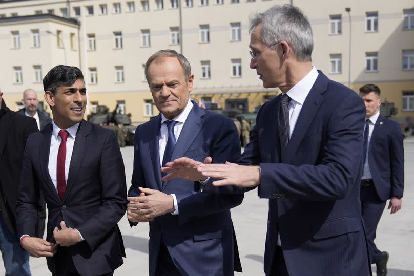 Britain's Prime Minister Rishi Sunak, left, Poland's Prime Minister Donald Tusk and NATO Secretary General Jens Stoltenberg arrive together at the Armourd Brigade barracks.