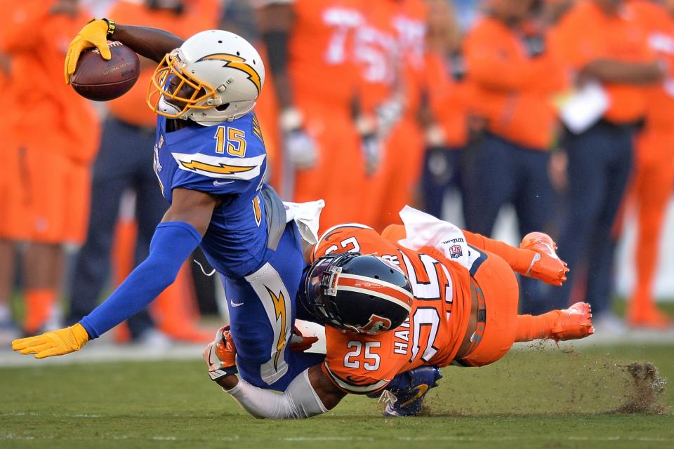 <p>San Diego Chargers wide receiver Dontrelle Inman (15) dives forward as Denver Broncos cornerback Chris Harris (25) tackled him during the first quarter at Qualcomm Stadium. Mandatory Credit: Jake Roth-USA TODAY Sports </p>