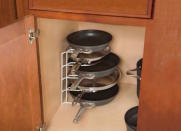 <body> <p>Cure cabinet chaos on the cheap with a storage solution borrowed from <a rel="nofollow noopener" href=" http://www.bobvila.com/slideshow/10-space-smart-ways-to-squeeze-in-a-home-office-48561?bv=yahoo" target="_blank" data-ylk="slk:your workspace;elm:context_link;itc:0;sec:content-canvas" class="link ">your workspace</a>. Stash an off-duty office organizer inside a deep cabinet to provide a perch for pots and pans, lids, and other tools of the culinary trade. As an added bonus, this organizer can be transferred to the countertop to store your favorite recipe books.</p> <p><strong>Related: <a rel="nofollow noopener" href=" http://www.bobvila.com/slideshow/11-cheap-cures-for-a-cluttered-kitchen-49769?#.V-Rg6pMrKRs?bv=yahoo" target="_blank" data-ylk="slk:11 Cheap Cures for a Cluttered Kitchen;elm:context_link;itc:0;sec:content-canvas" class="link ">11 Cheap Cures for a Cluttered Kitchen</a> </strong> </p> </body>