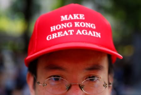 A protester is seen wearing a cap that reads, "Make Hong Kong Great Again" in Central