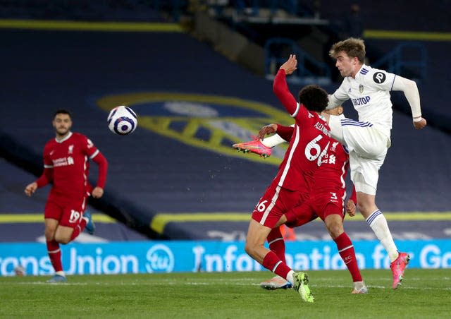 Patrick Bamford, right, has a shot at goal against Liverpool