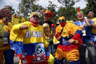 <p>Colombia fans get in on the carnival atmosphere with a replica world cup trophy. (PA) </p>