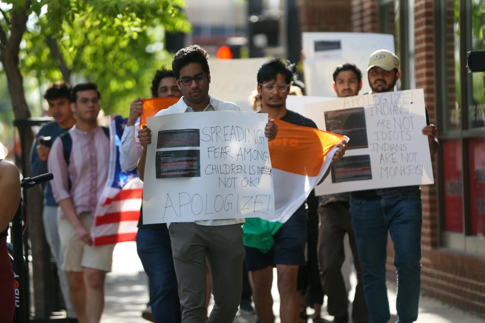 Purdue University students march in protest against the owner of the Blue Nile Restaurant over alleged racist comments he made about Indians, on May 5, 2023, in West Lafayette, Ind.