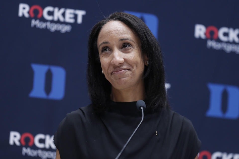 FILE - New Duke athletic director Nina King reacts to applause during an introductory press conference Friday, May 21, 2021, at Cameron Indoor Stadium in Durham, N.C. As a result of an investigation, Brigham Young University said it has lifted a ban on a fan who was identified as directing racial slurs toward Duke sophomore volleyball player Rachel Richardson during a volleyball match on Aug. 26. Duke athletic director Nina King issued a statement standing by Richardson and the rest of her team.(Ethan Hyman/The News & Observer via AP, File)