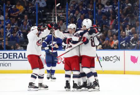 Apr 10, 2019; Tampa, FL, USA; Columbus Blue Jackets defenseman Seth Jones (3) celebrates with teammates after scoring the game winning goal against the Tampa Bay Lightning during the third period of game one of the first round of the 2019 Stanley Cup Playoffs at Amalie Arena. Mandatory Credit: Kim Klement-USA TODAY Sports