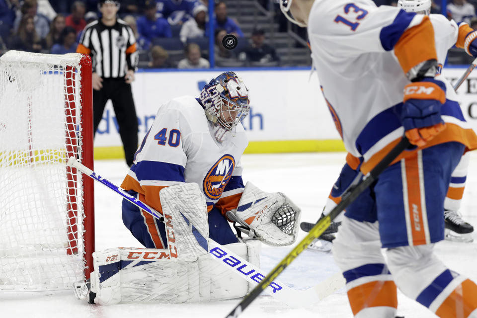 New York Islanders goaltender Semyon Varlamov (40) makes a save on a shot by the Tampa Bay Lightning during the second period of an NHL hockey game Monday, Dec. 9, 2019, in Tampa, Fla. (AP Photo/Chris O'Meara)