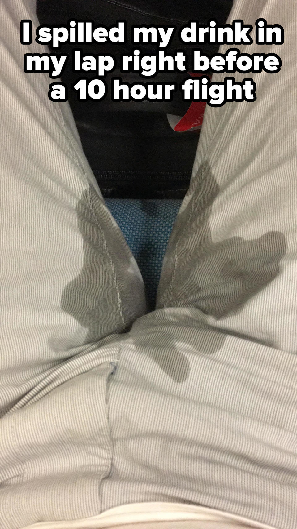 a man with a spilled drink on his pants