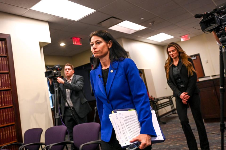 Michigan Attorney General Dana Nessel
makes her way to the podium before announing charges in a public integrity investigation during a press conference on Thursday, Dec. 21, 2023, at the G. Mennen Williams Building in downtown Lansing.