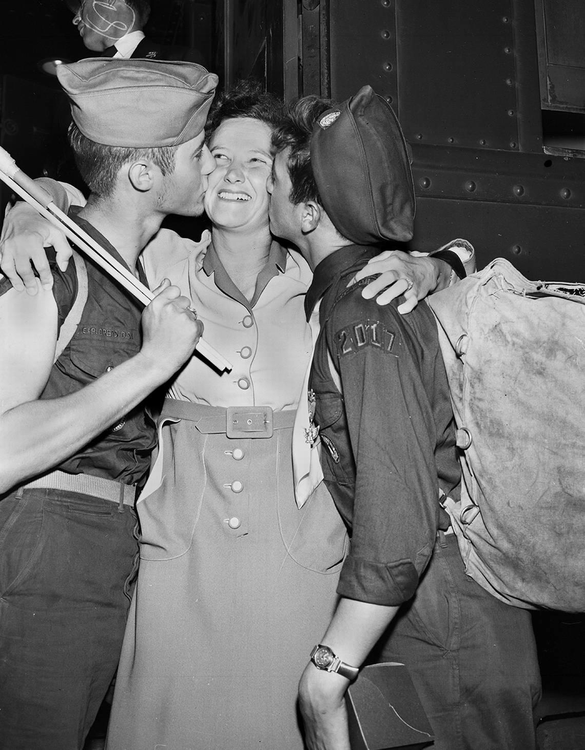 July 10, 1950: Carl Jr., left, and Ronald Graner greet their mother, Mrs. Carl Graner, with a kiss at T&P Station. They both attended the Boy Scout Jamboree at Valley Forge, Penn., with 105 other Fort Worth Scouts. They are Eagle Scouts of Explorers Post 2017. Fort Worth Star-Telegram archive/UT Arlington Special Collections